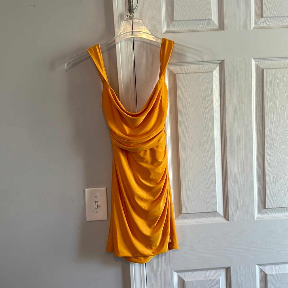 A orange dress that ties in back from Lucy in the Sky. Size small.
